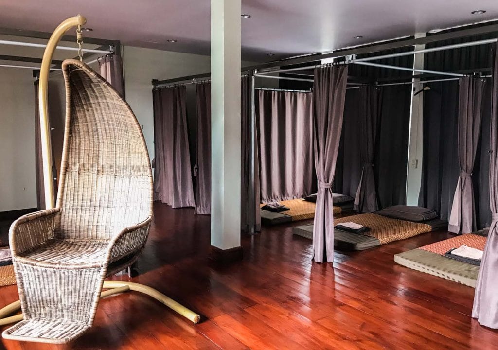 Room with thai massage mattresses and curtains