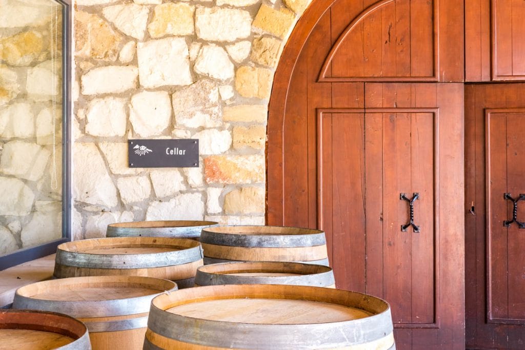 Wine barrels and entrance to the cellar at Karavitakis