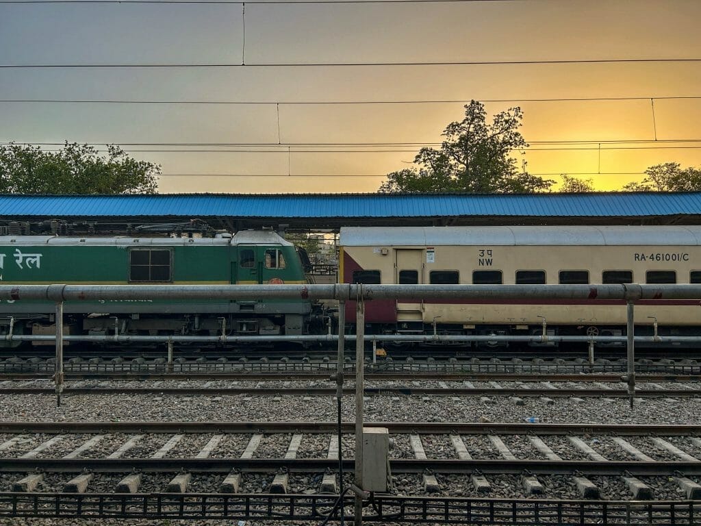 Sun rising between trains in the Jaipur station