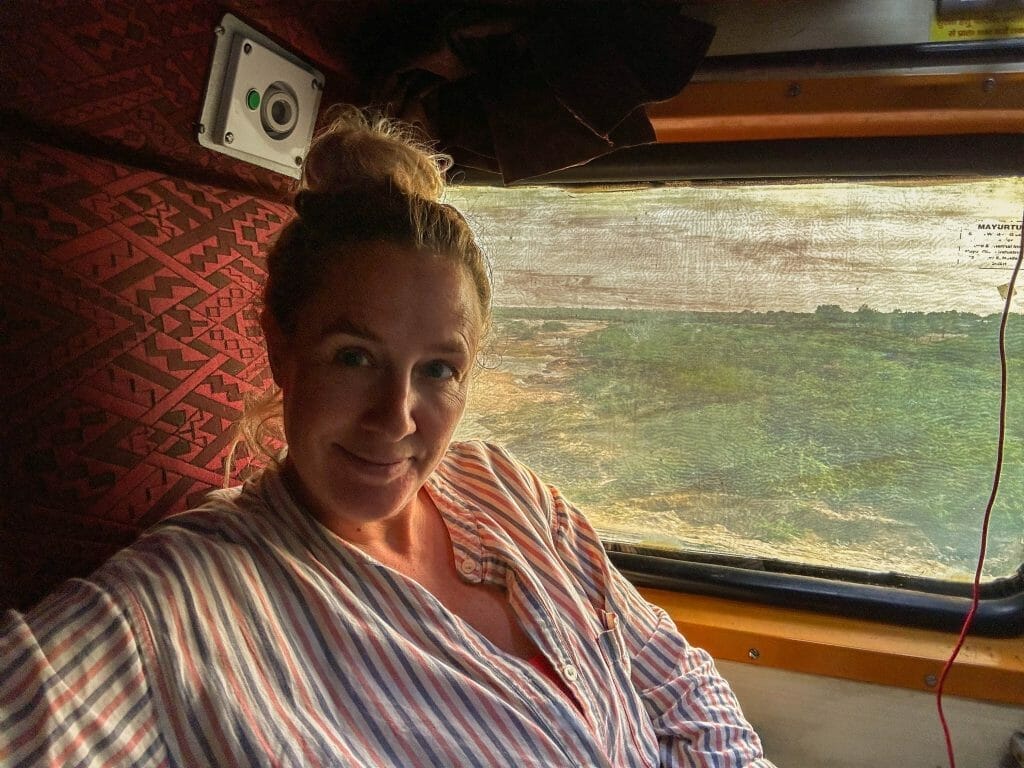 Annika Ziehen in front of a window on a train in India