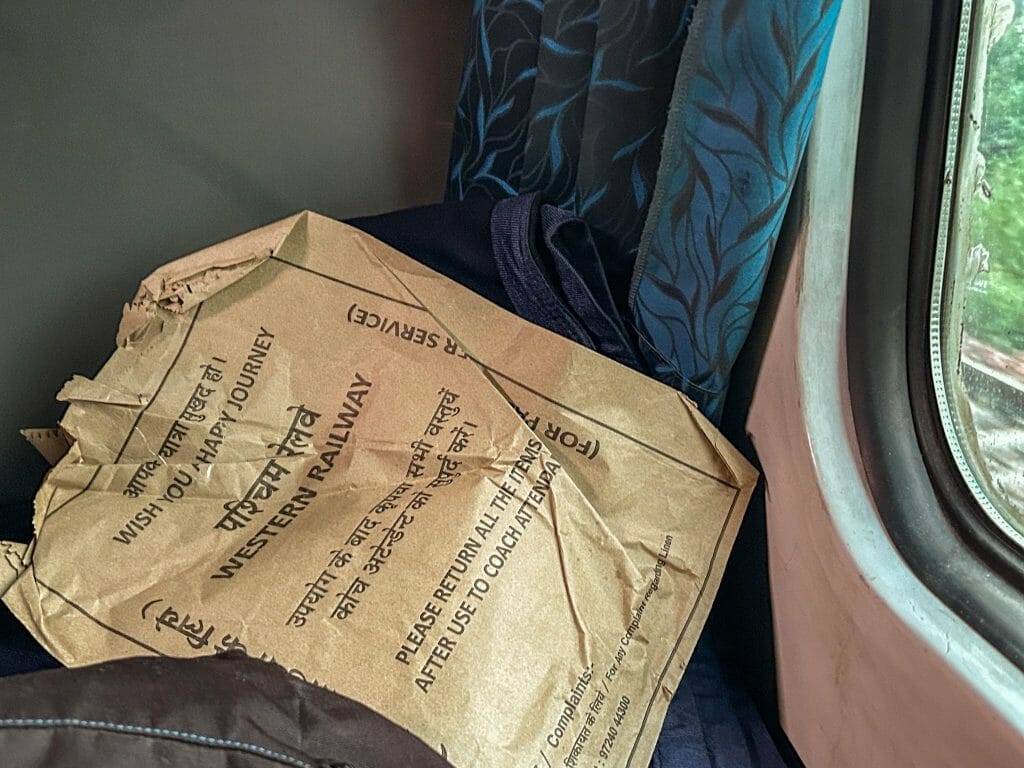Paper packet with linens on a train in india